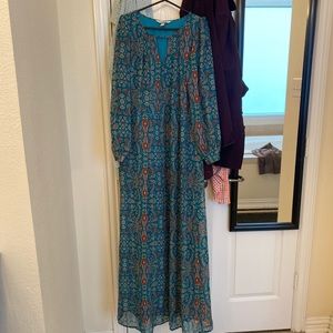 Long dress with full sleeves.